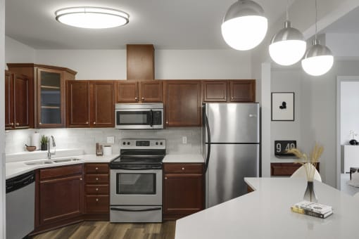 Kitchen with island and appliances at The Gables at Park Pointe, St. Louis Park, Minnesota