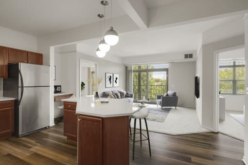 an open kitchen and living room at The Gables at Park Pointe, St. Louis Park, MN