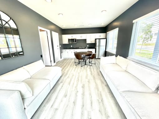 a living room with couches and a table at Murdock Gardens Apartments, Lafayette, IN 47904