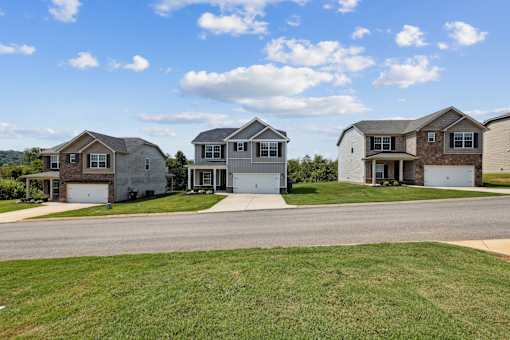 A row of houses with a clear blue sky above them.