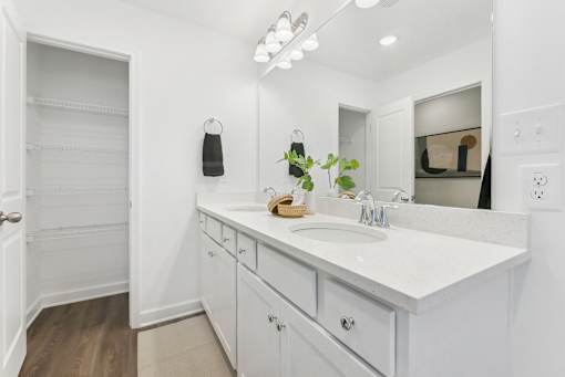 Elegant bathroom featuring double vanity and designer lighting