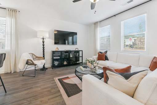 Open-concept living area with cozy fireplace feature