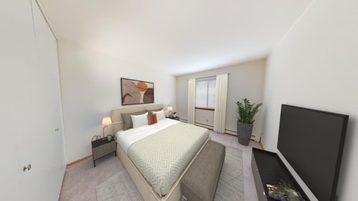 a bedroom with a large bed and a tv