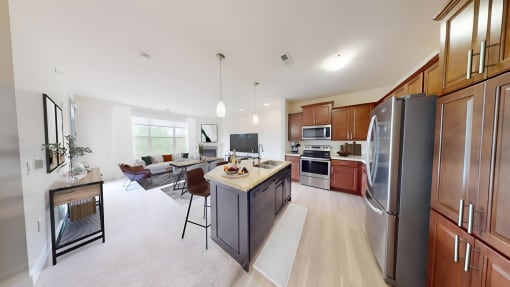 a large kitchen and living room with a table and chairs
