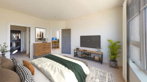 a bedroom with a bed and a television