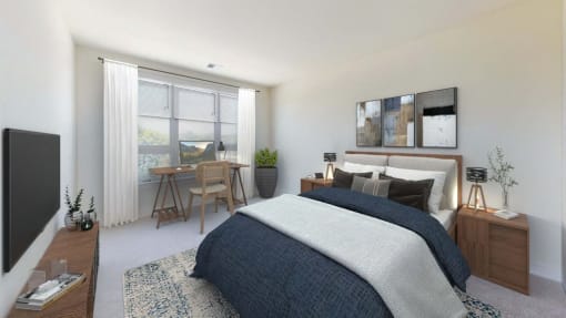an open bedroom with a bed and a desk with a window
