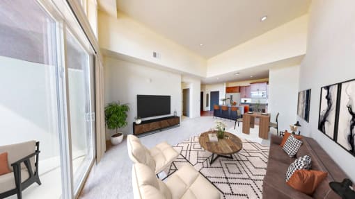 a living room with a couch and a table and a television