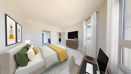 a bedroom with a bed and a desk with a laptop