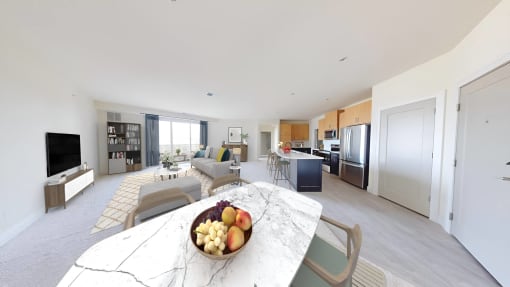 a living room with a table with a bowl of fruit