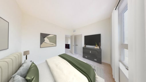 the master bedroom has a large bed and a tv in the corner
