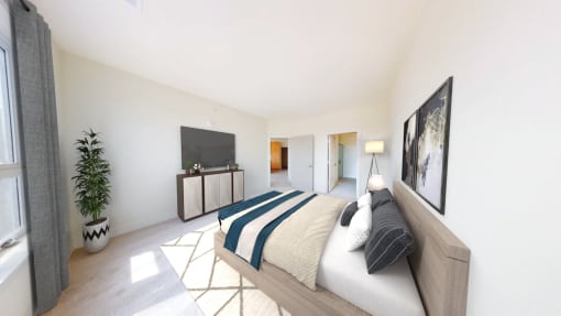 a bedroom with a bed and a tv