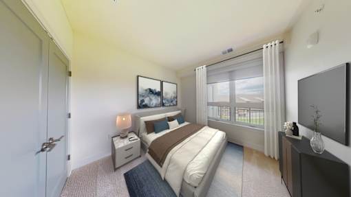 A bedroom with a large bed, a nightstand with a lamp, and a window with curtains.