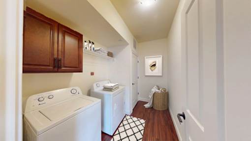 A laundry room with a washer and dryer.