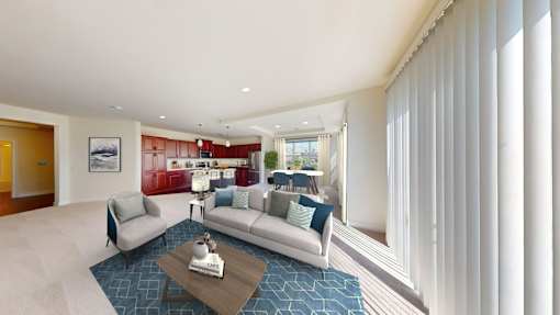 A living room with a grey couch and a coffee table.
