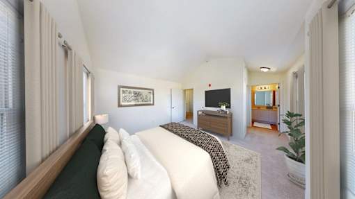 A bedroom with a bed, dresser, and mirror.