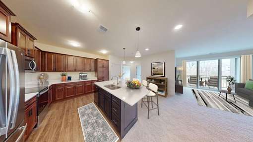 A modern kitchen with wooden cabinets and a central island.