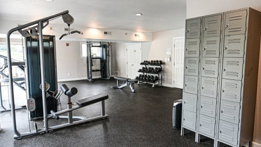 a home gym with weights and other exercise equipment