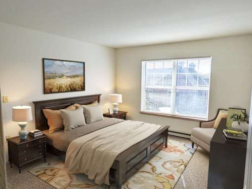 a bedroom with a bed and a window