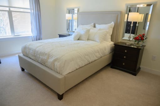 a bedroom with a bed and a dresser