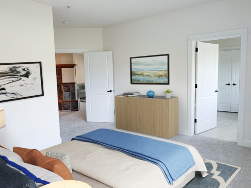 a bedroom with a bed and a desk and a closet