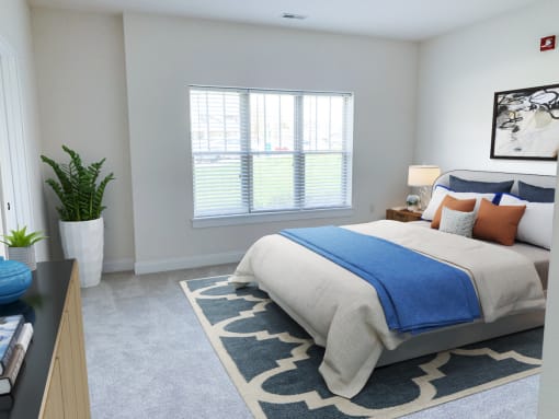 a bedroom with a bed and a potted plant