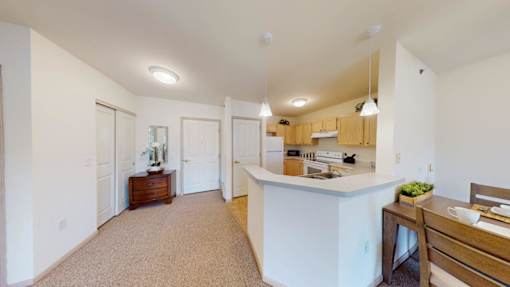 A kitchen with a counter and a sink.