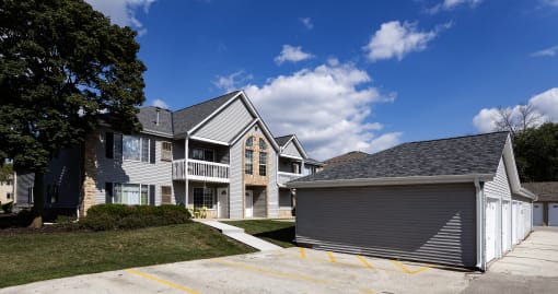 a row of houses with a blue sky in the background