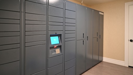 a row of gray lockers with a screen on the door