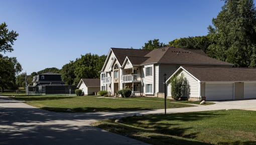 a row of houses in a neighborhood with a basketball court