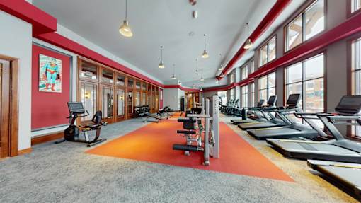 A gym with treadmills and exercise bikes.