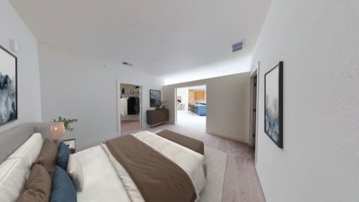 a bedroom with a bed and a couch in a room