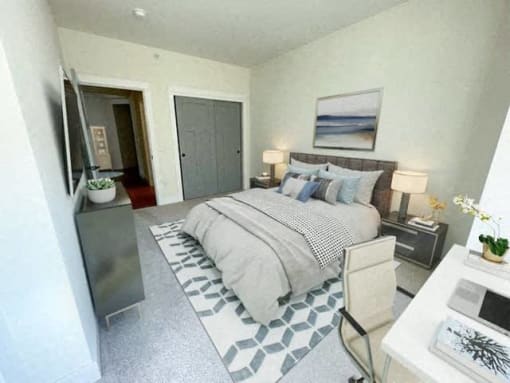a bedroom with a bed and a tv