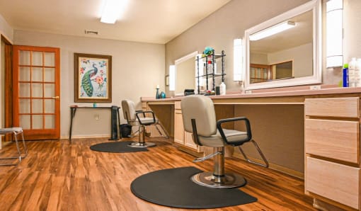a salon room with three chairs and a counter