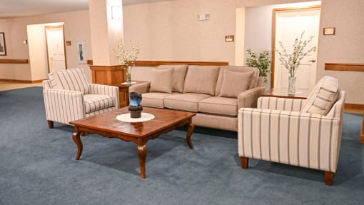 a living room with couches and chairs and a coffee table