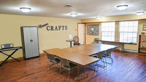 a conference room with a long wooden table and chairs