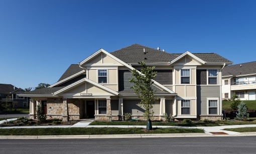 a large house with a street in front of it