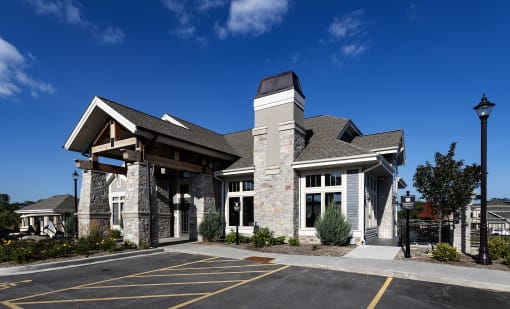 a view of the front of a building with a parking lot