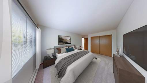 A bedroom with a bed, nightstand, and a window with blinds.