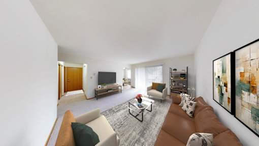 A living room with a brown couch and a television.