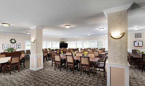 a large dining room with tables and chairs and a television