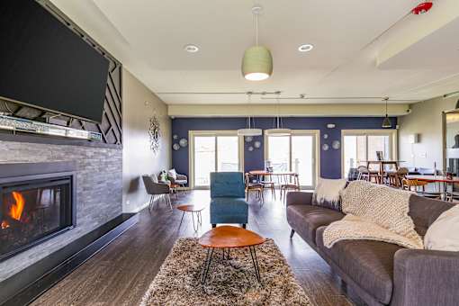 A living room with a fireplace and a couch.