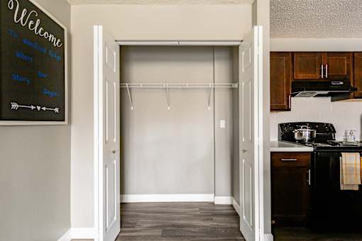 A kitchen with a blackboard on the wall.