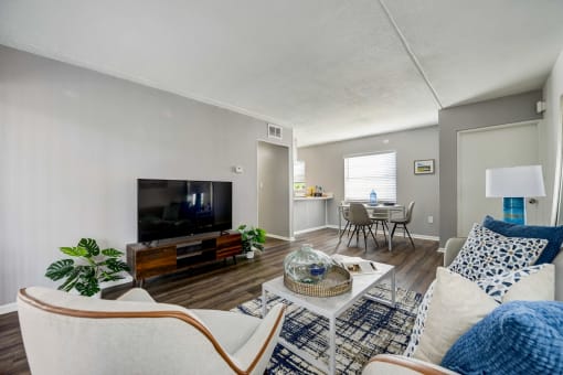 a living room with a couch and a table and a tv