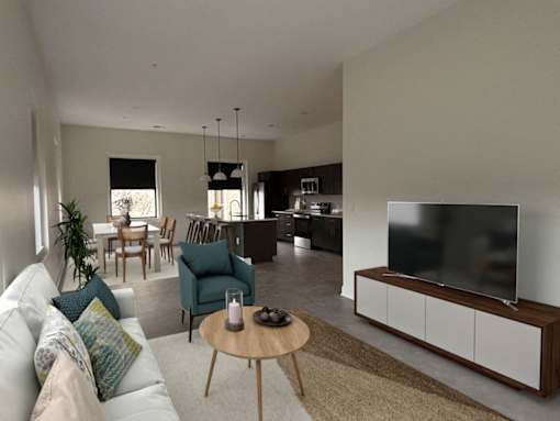 A modern living room with a white couch and a television.