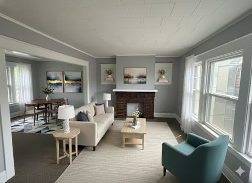 A living room with a fireplace, a couch, a chair, and a dining table.