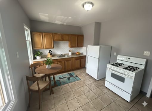 A kitchen with white appliances and wooden cabinets.