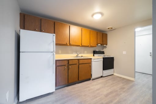 Open Kitchen with cabinets at Willowbrooke Apartments & Townhomes at 396 Willowbrooke Drive in Brockport, NY 14420