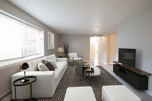 Updated Living Room at Willowbrooke Apartments & Townhomes at 396 Willowbrooke Drive in Brockport, NY 14420