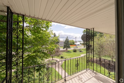 a view of the yard from the balcony of a house
