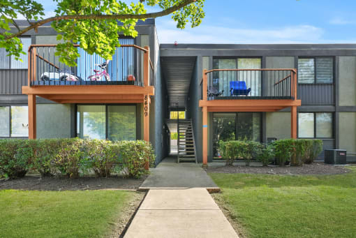 Exterior with greenery at Woodland Ridge Apartments in Woodridge, IL
